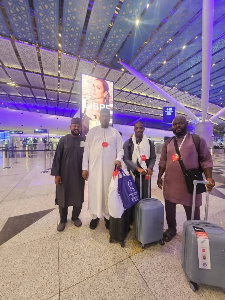 Armburu pilgrims with luggage at the airport terminal before departure