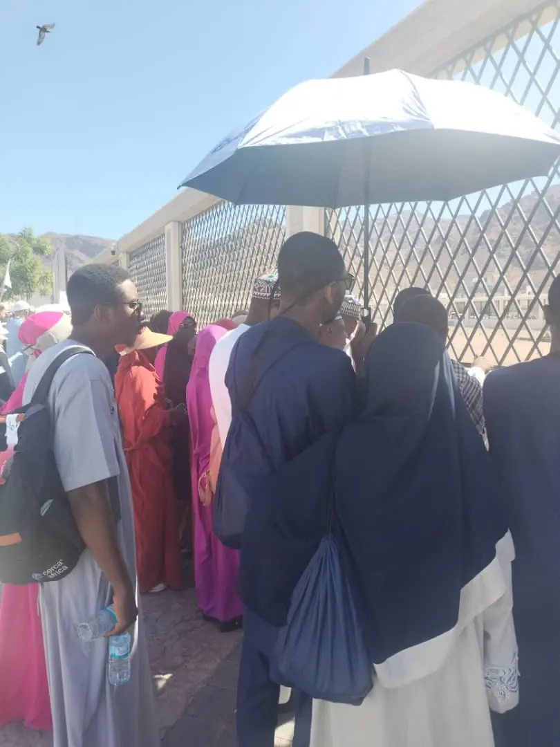 Pilgrims on a guided ziyarah visit to a historic site