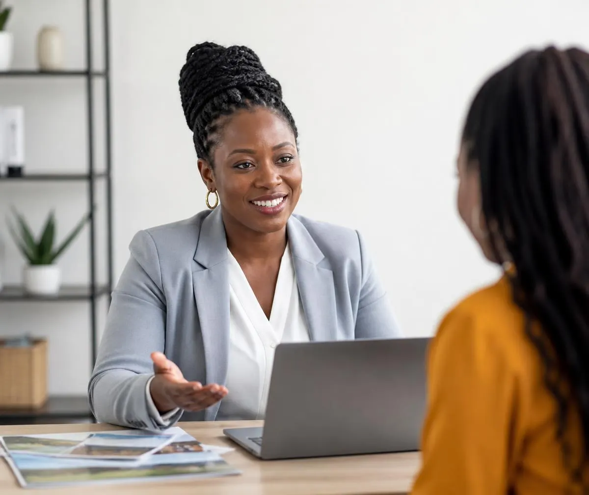 Travel consultant advising a client in an Armburu Travels office